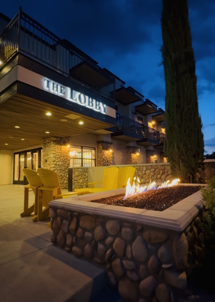 tavern hotel cottonwood, az lobby entrance with fireplace.